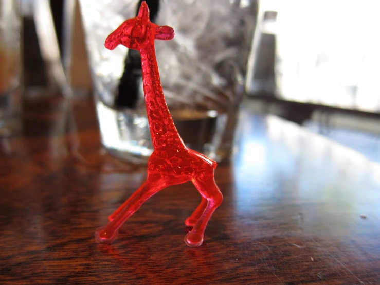 glass figure made to look like a giraffe on table