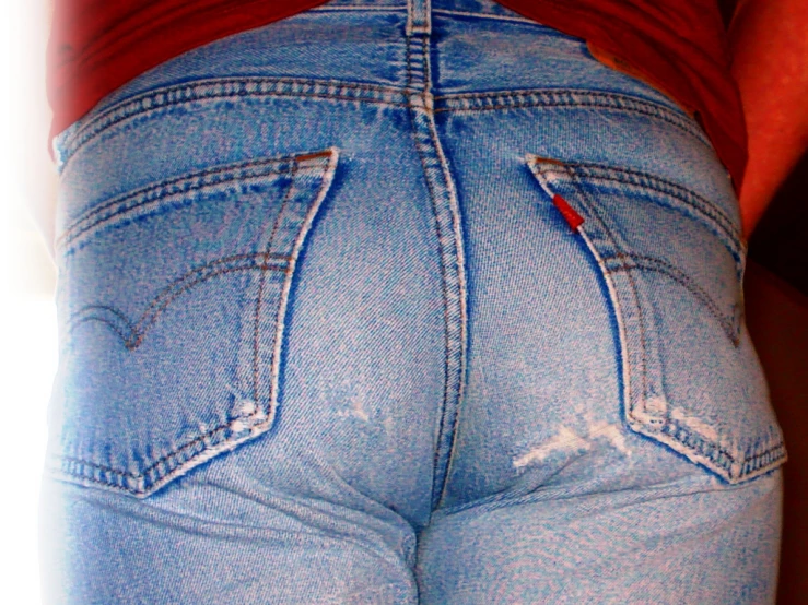 a woman has her cell phone in her pocket
