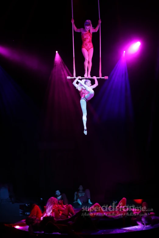 a girl on a platform at a circus