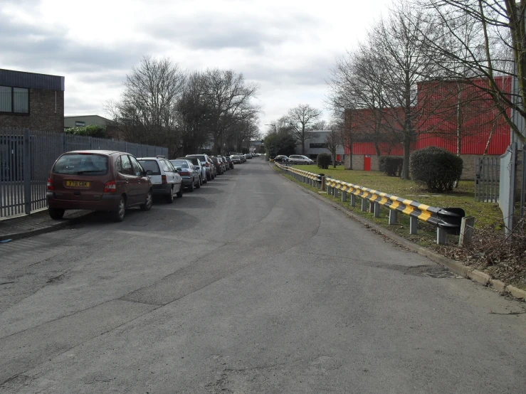 a street lined with lots of parked cars