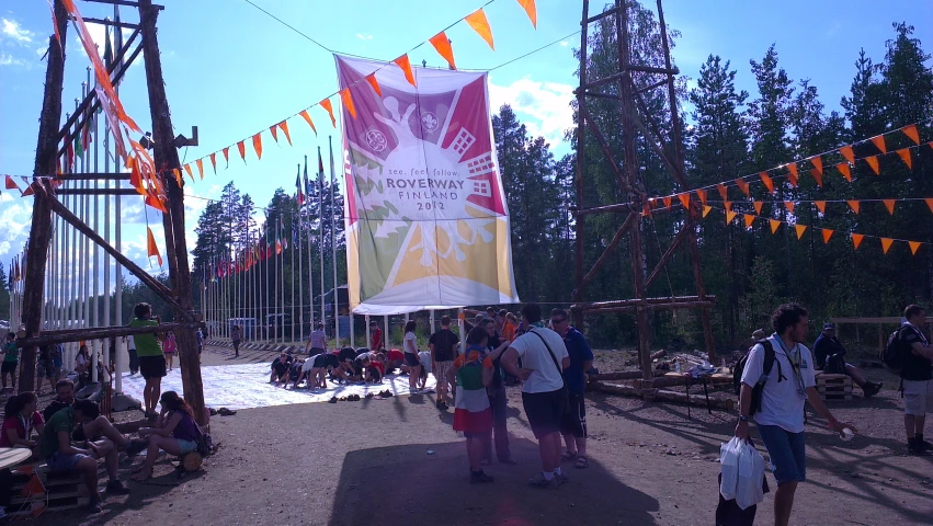 a group of people outside during the day