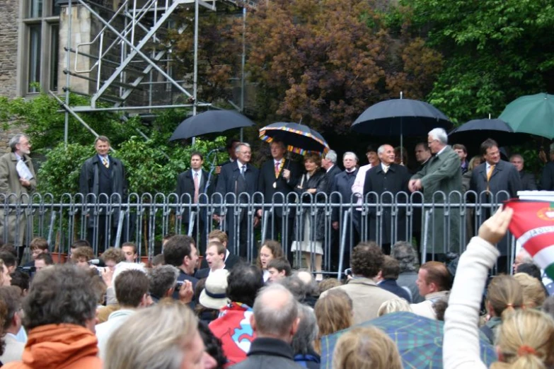 a crowd of people standing next to each other