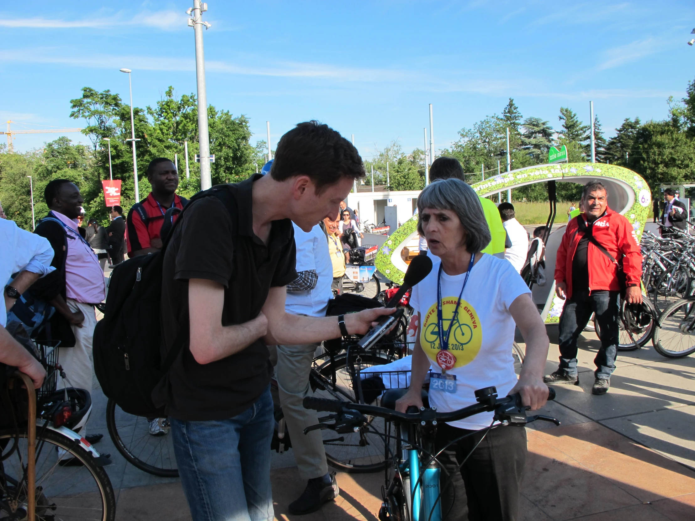 two people on bicycles are using their phones