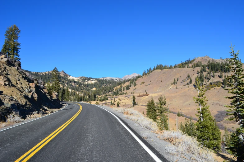 this is a road in the mountains with no traffic