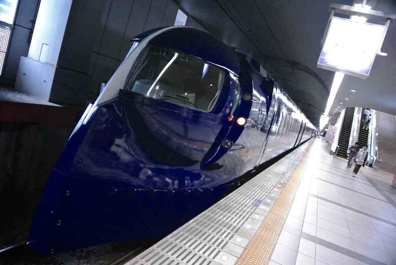 a high speed train is sitting next to the platform