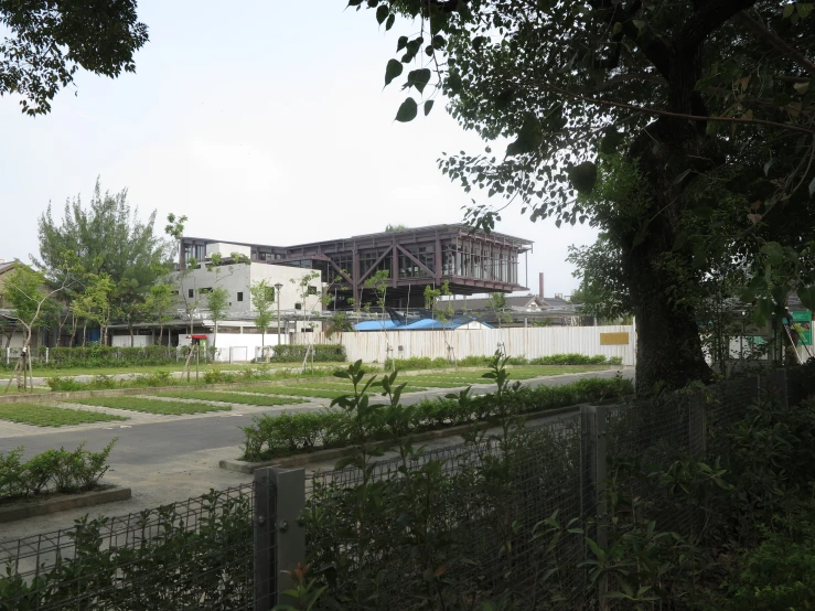 a fence is shown as it passes near a building