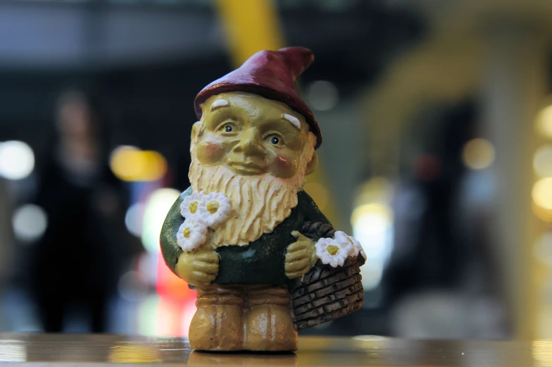 a statue of a garden gnome on a counter