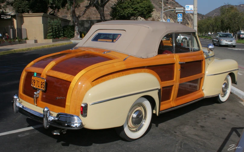 a vintage car is parked on the street