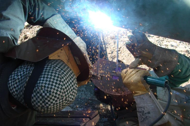 welders using a welder tool to cut metal