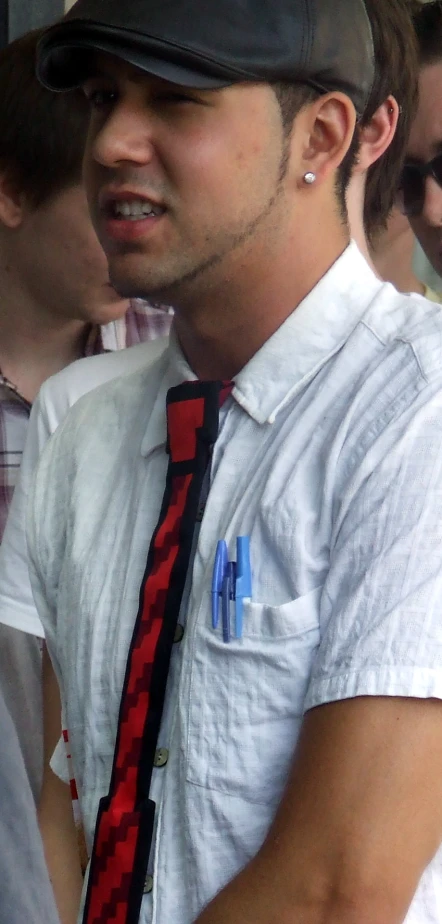 a man with a hat, tie and shirt