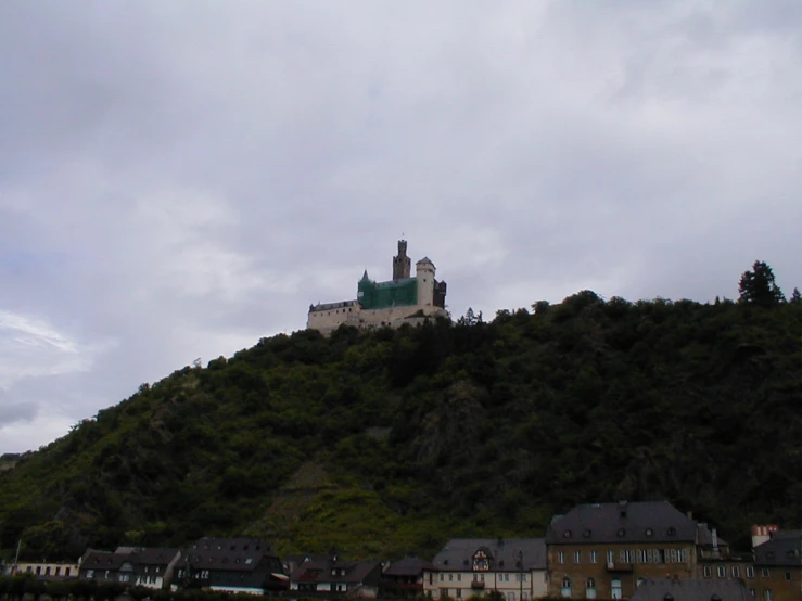 this is a castle atop the hill, with it's spires high above