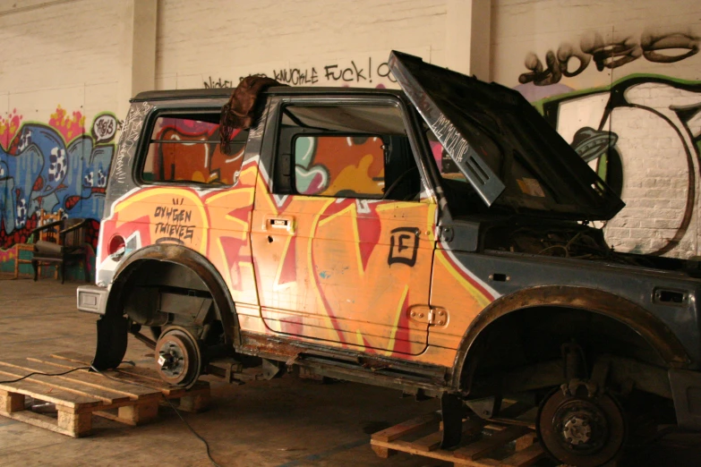 a truck with a paint covered back door parked