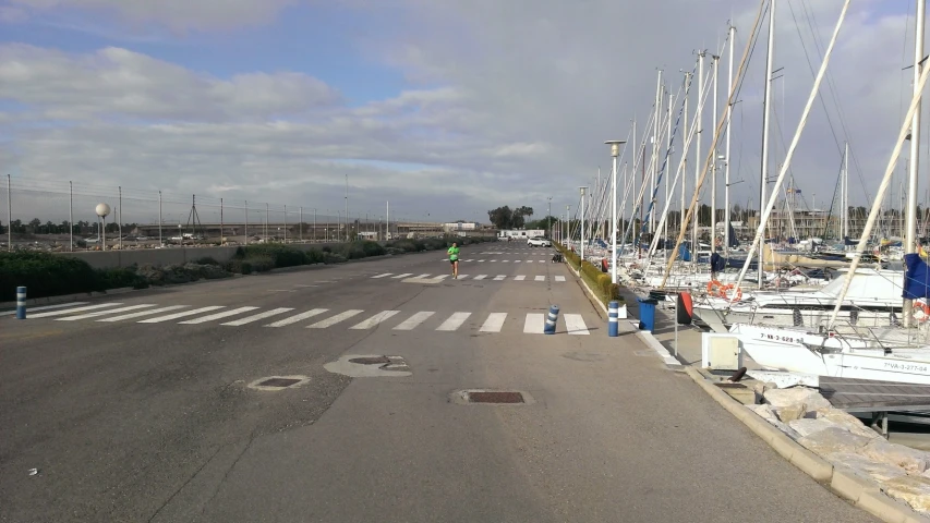 several sailboats docked next to each other on a city street