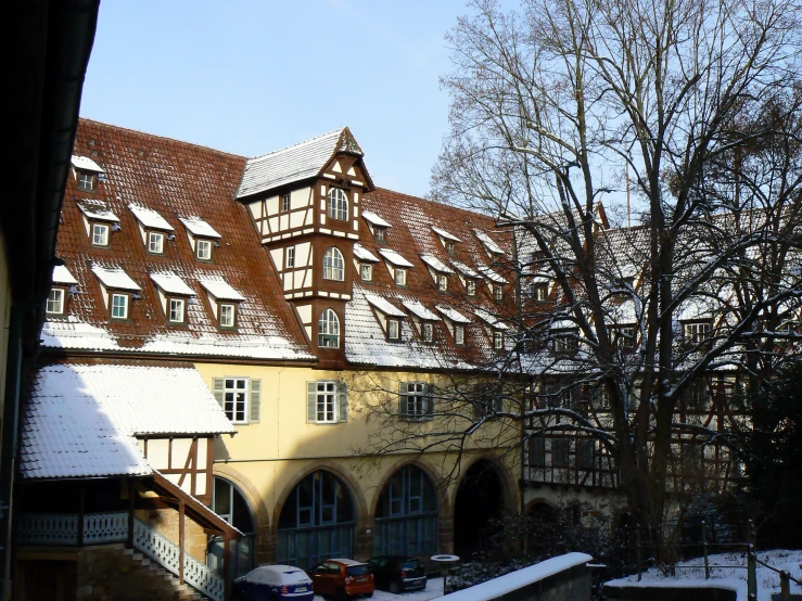 the roof tops of buildings in winter with snow