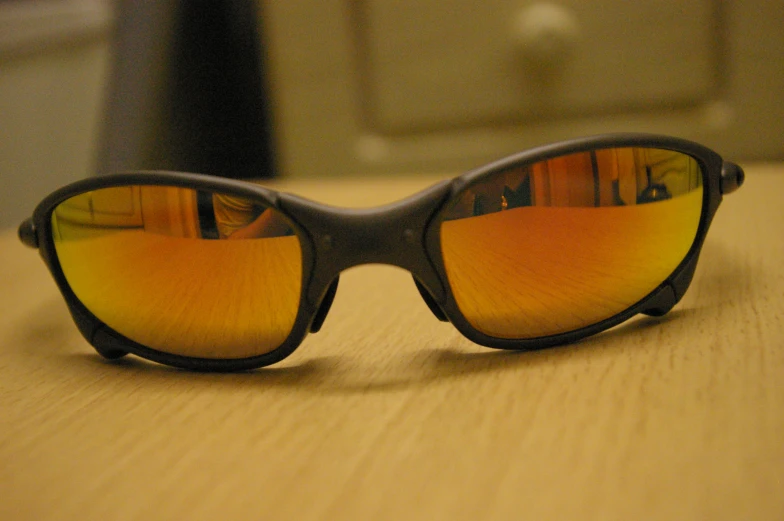 a pair of sunglasses reflecting a kitchen scene