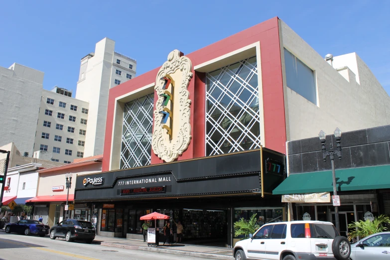 an art deco store next to the road