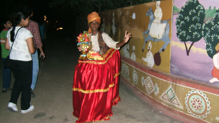 man in colorful costume dancing on the street