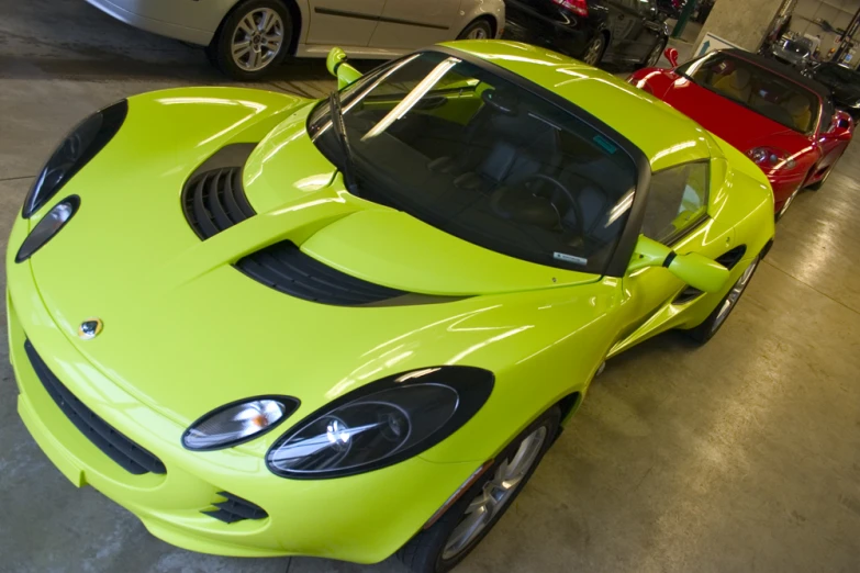 a neon yellow car parked in a garage