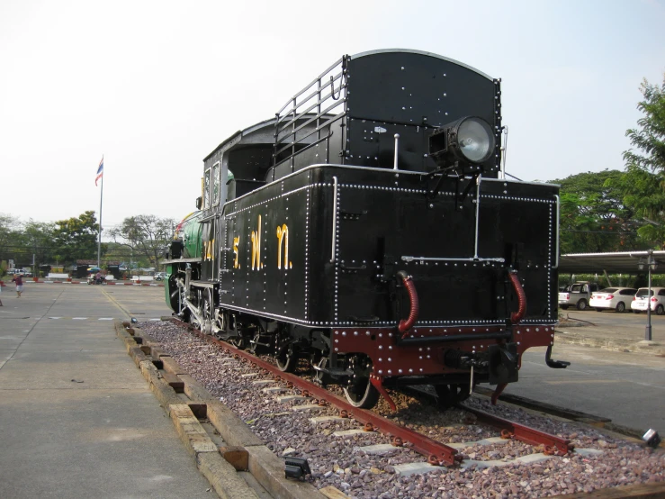 a train on a train track sitting in the middle of a field