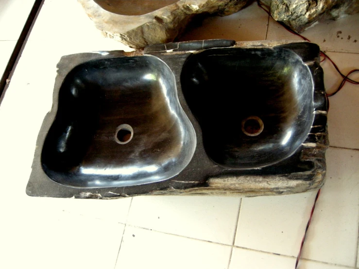 a pair of bathroom sinks sitting on top of a counter