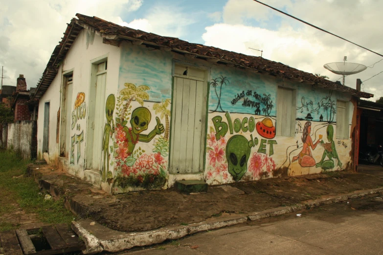 a small building with a colorfully painted front