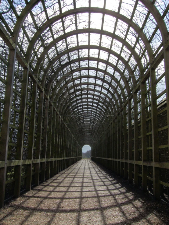 there is a tunnel that appears to have many fencingd in