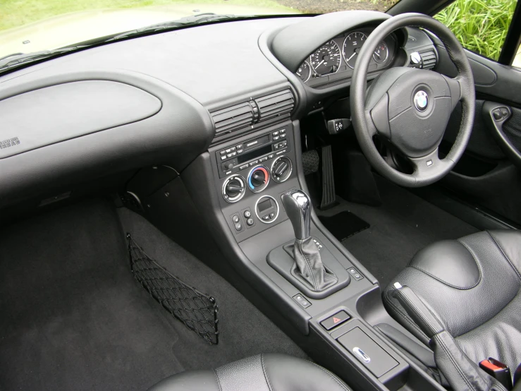 the dashboard and driver seat of a modern sports car