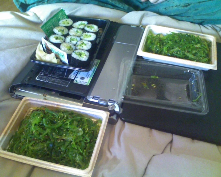 some plates of food on a bed in the middle of the night