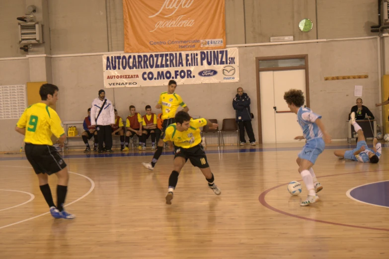 a group of young men playing a game of soccer