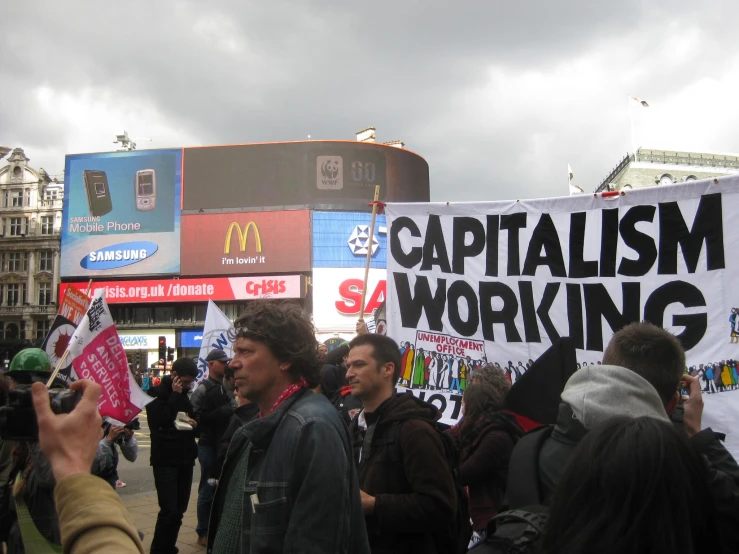 people gathered together to protest against capitalism in the city