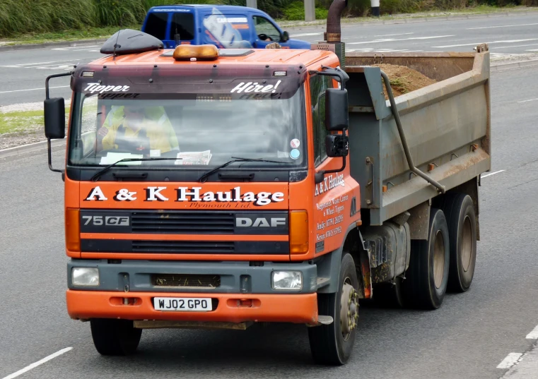 there is a large dump truck parked on the street