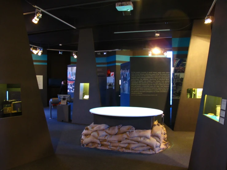 the display features large sacks and a white table