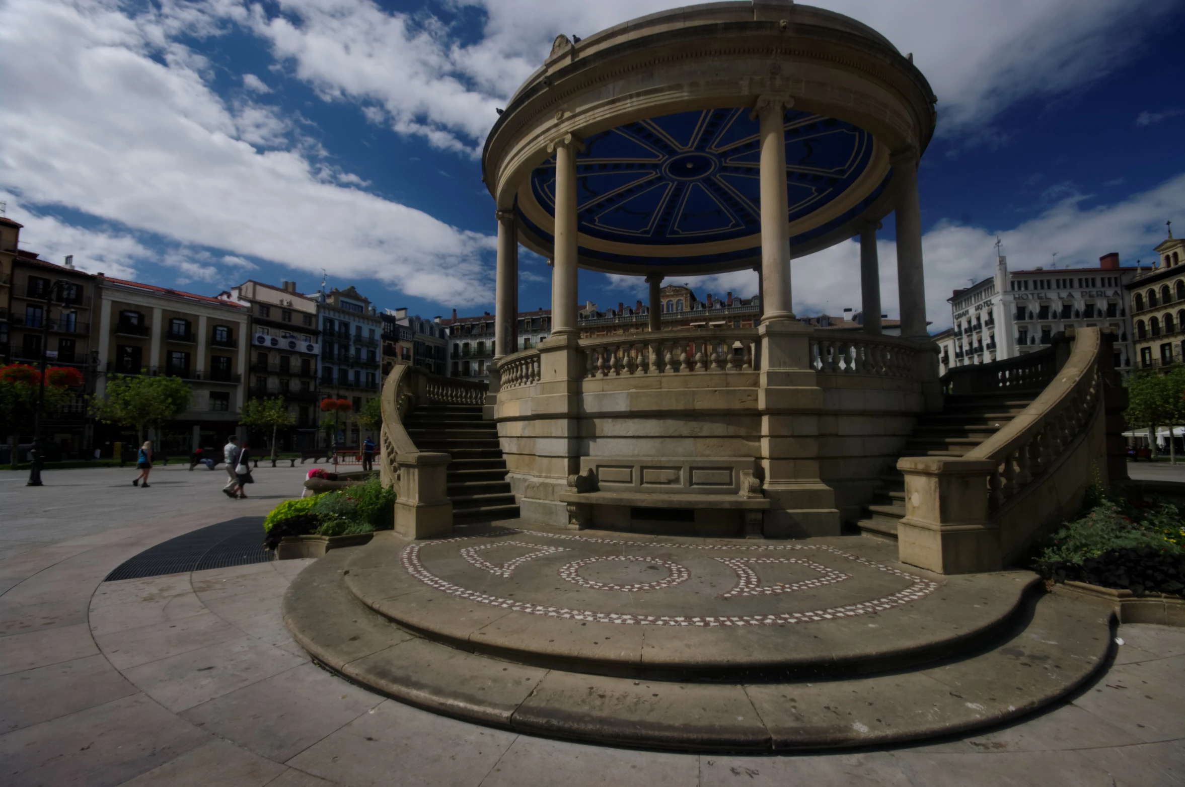 the view of a statue with a sky background