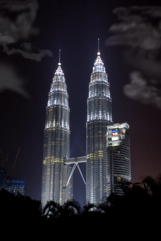 a tall structure lit up at night at the top