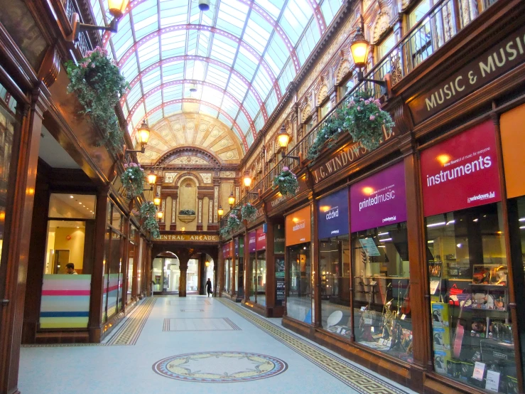 a large mall with many shops and lights