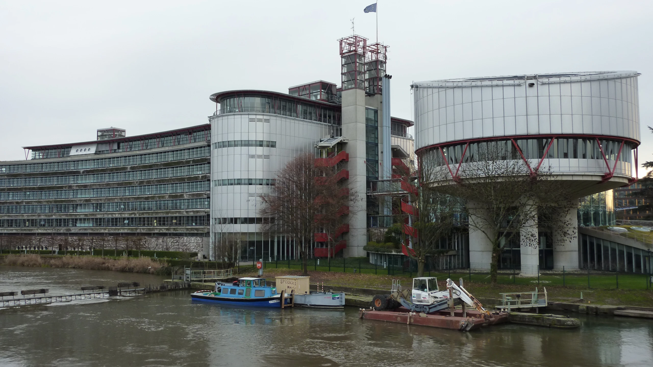 some buildings on the river side and the water