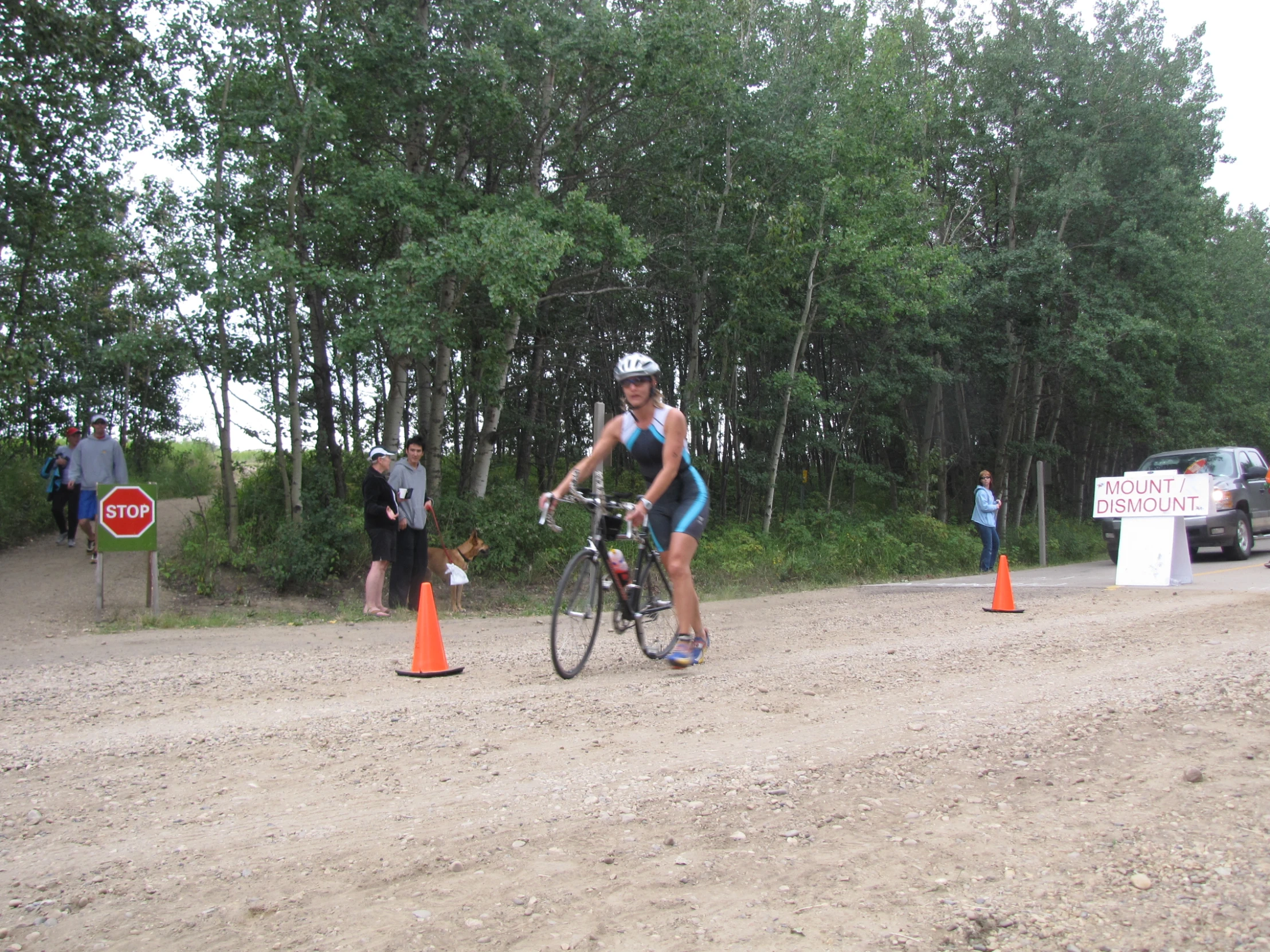 a person on a bike is racing through a course