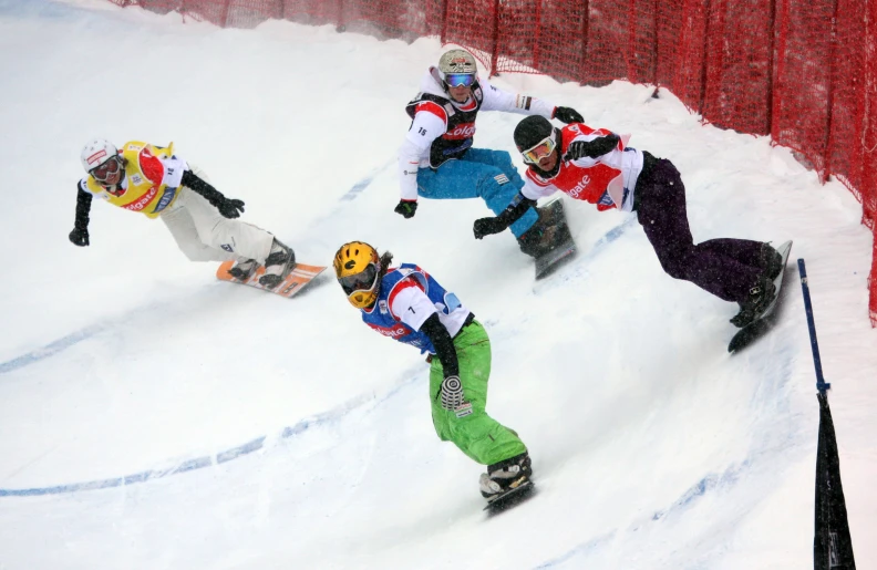 a group of people who are snowboarding down a hill