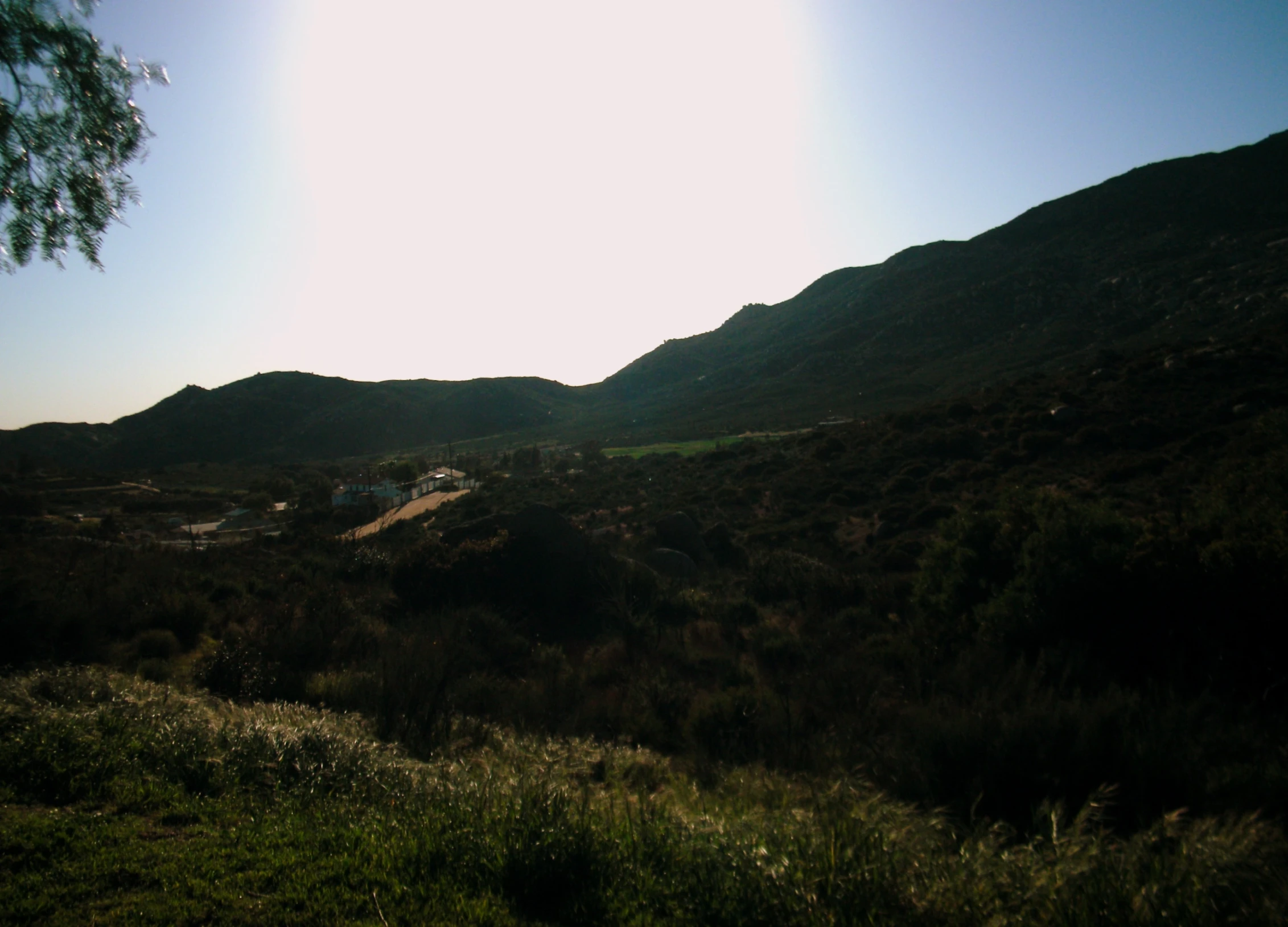 a road goes through a hilly mountain area