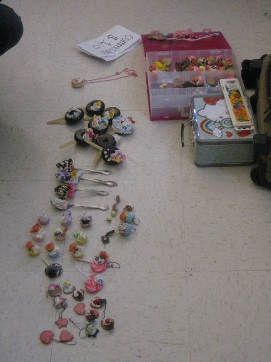 items on the ground, with one bag full of pins