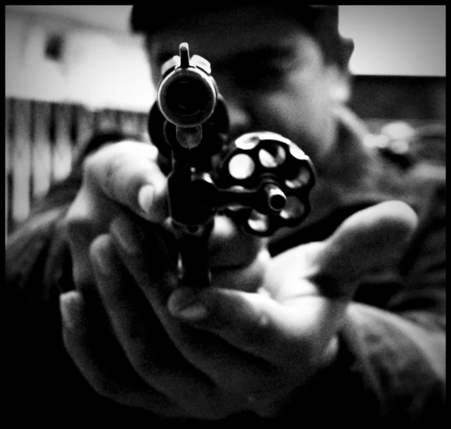 a man holding a gun in his hand