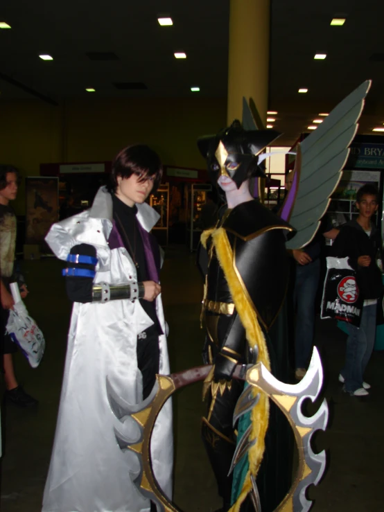 a woman standing next to a man in costume