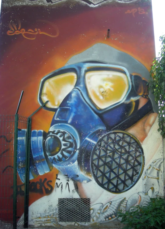 a grafiti shows a gas mask and a man