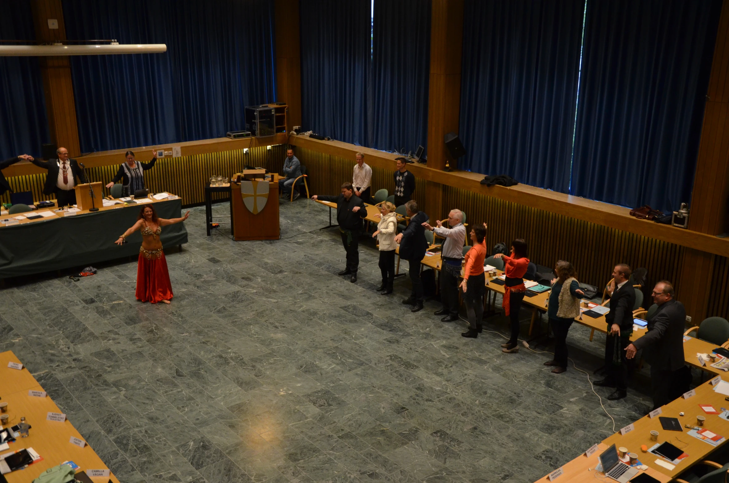 there is a group of people standing together in the room