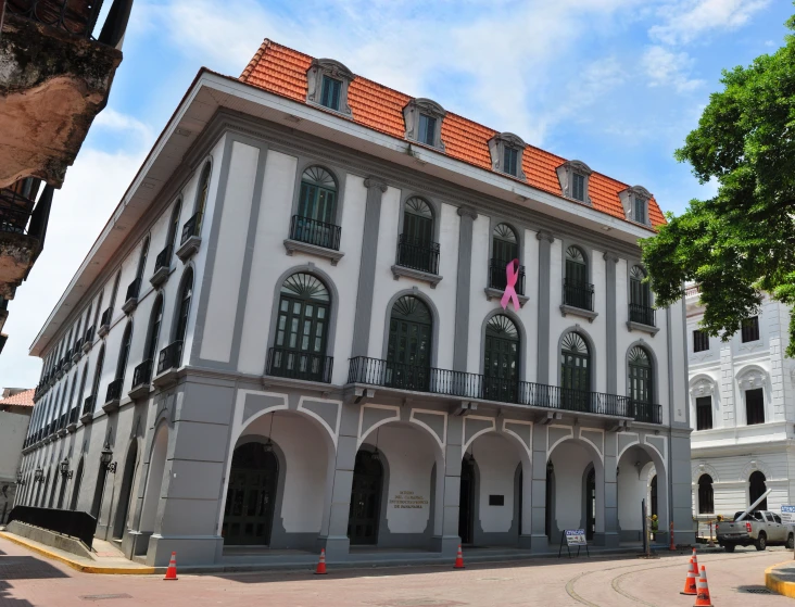 an older historic building with a red tiled roof