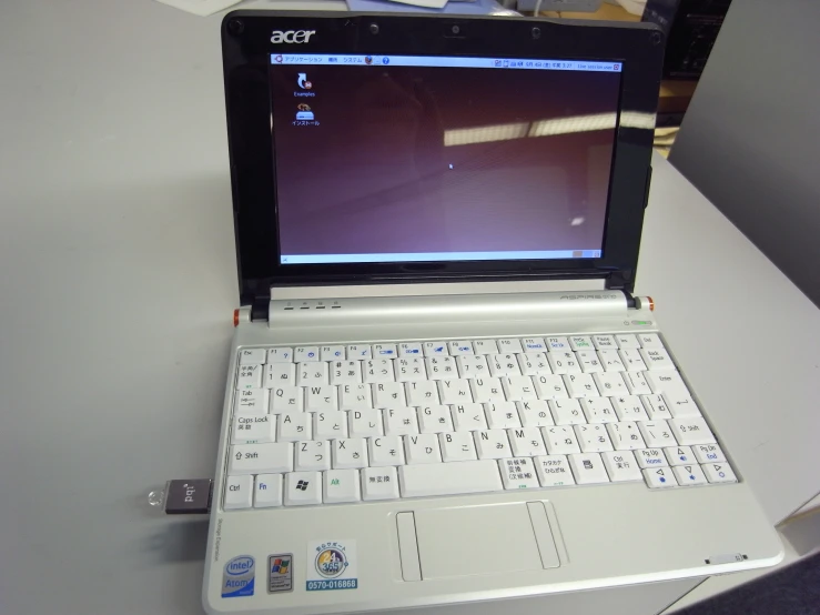 an open laptop computer sitting on top of a desk