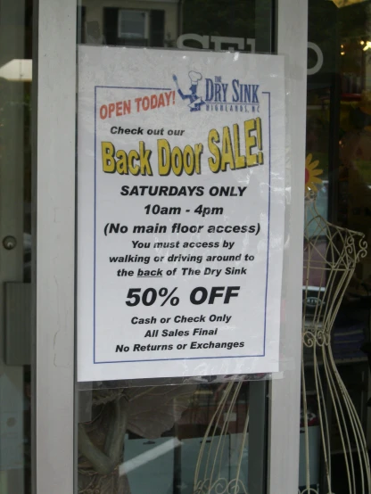 an image of a back door sale sign in a shop window