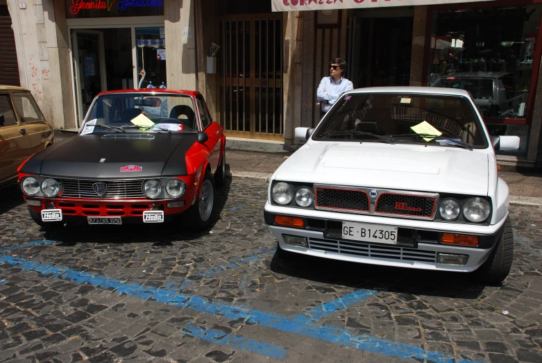 two cars parked on the side of the street