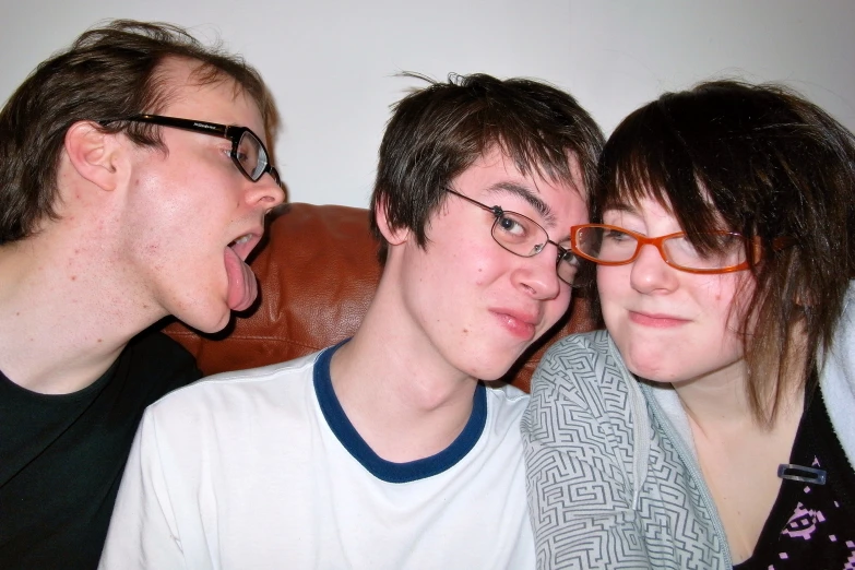 two young people are pictured with their mouths open