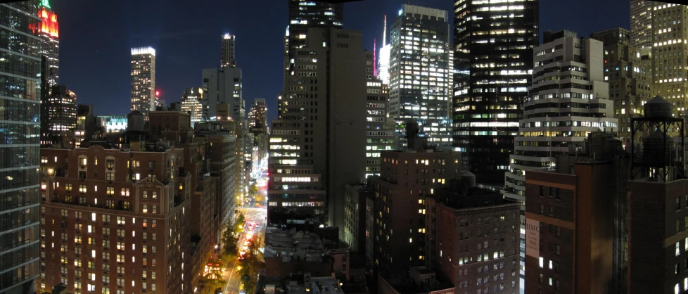 a cityscape at night, with bright lights in the skyscrs